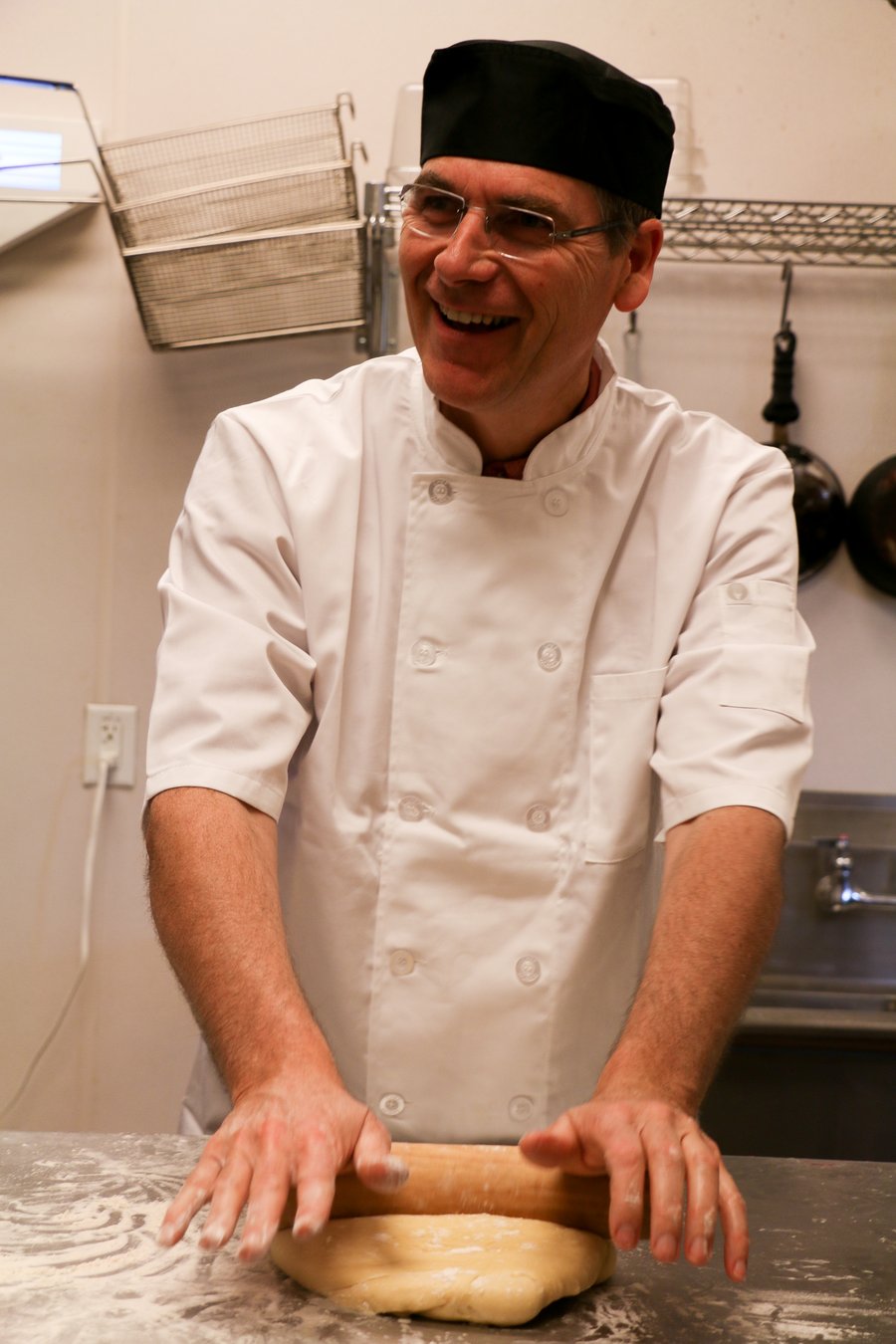 Pierre Vandamme hand-rolling Liège waffle dough at Bruges Belgian Bistro